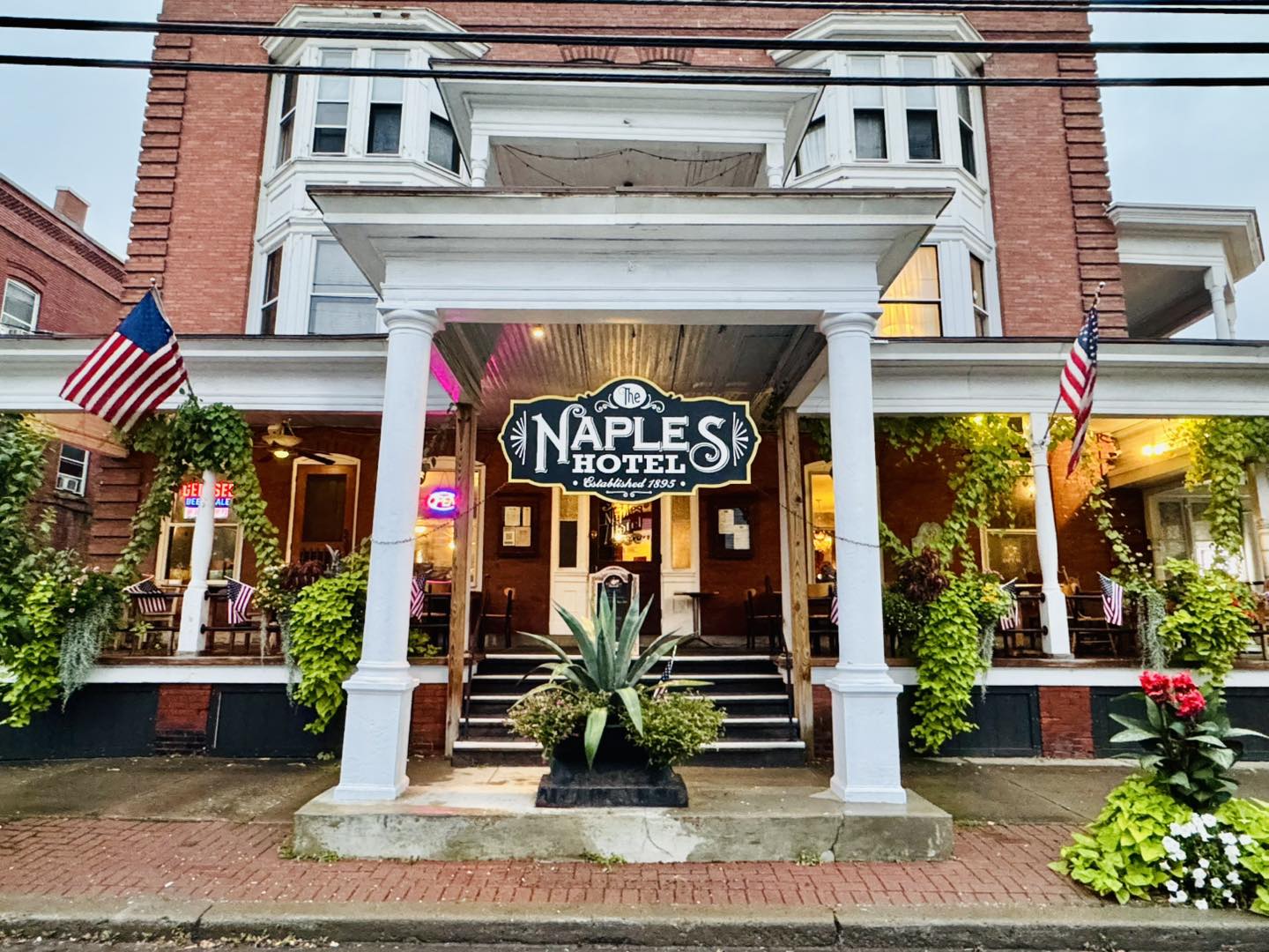 The Naples Hotel exterior at golden hour